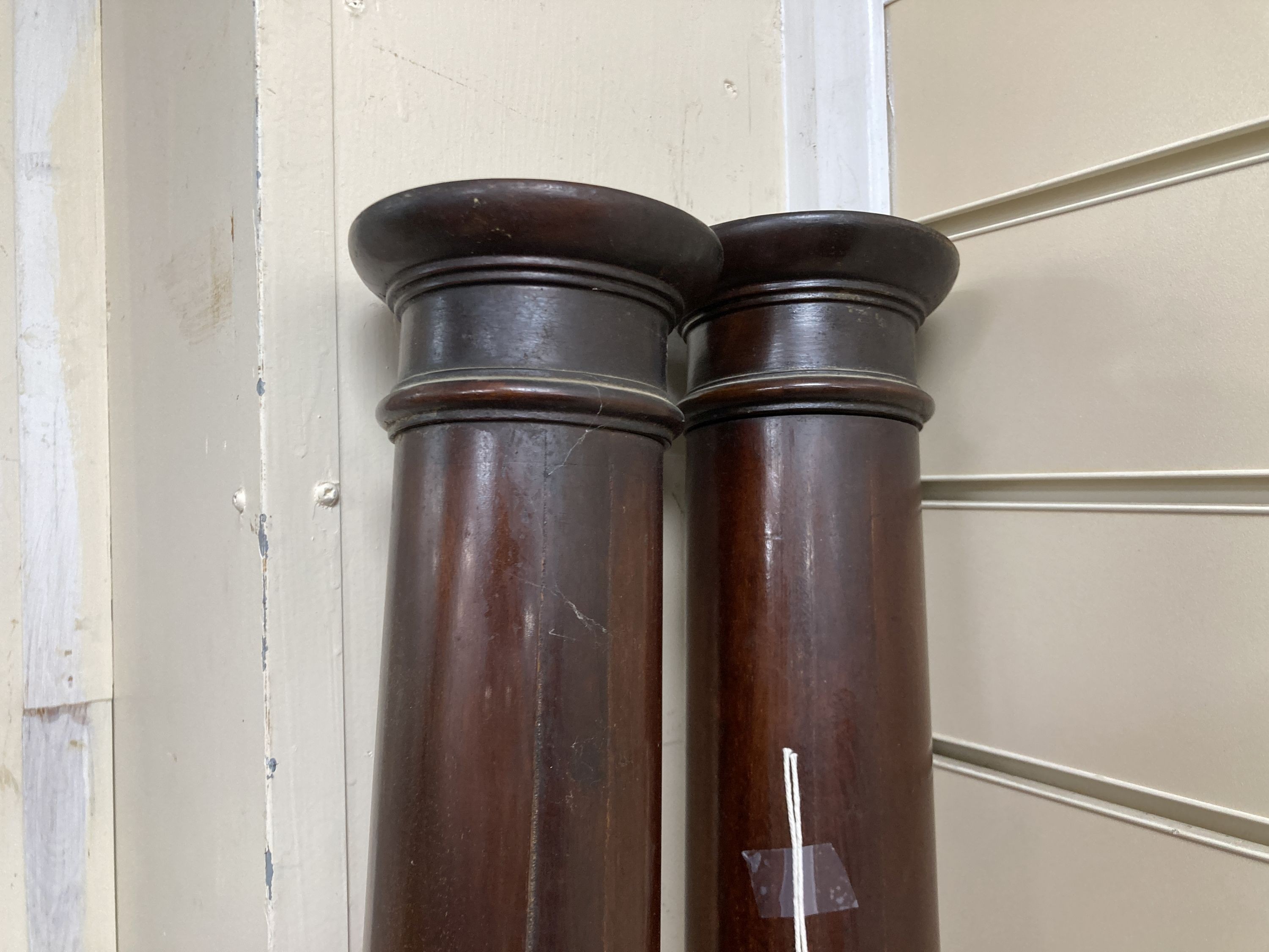 A pair of large mahogany columns. H-180cm.